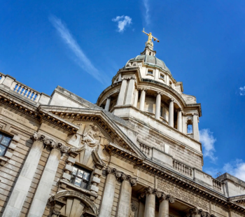 Historic building with ornate dome and columns.